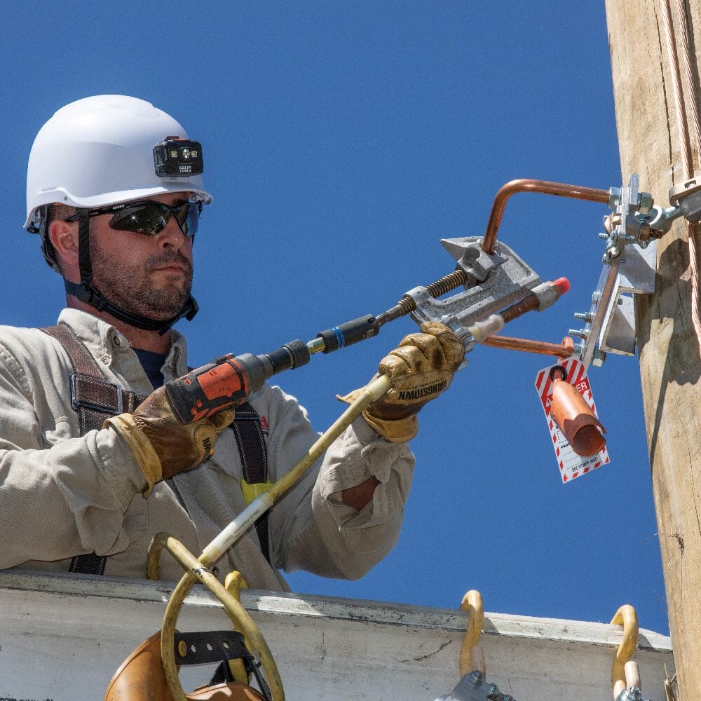 Lineman using Klein 3-in-1 Slotted Impact Socket